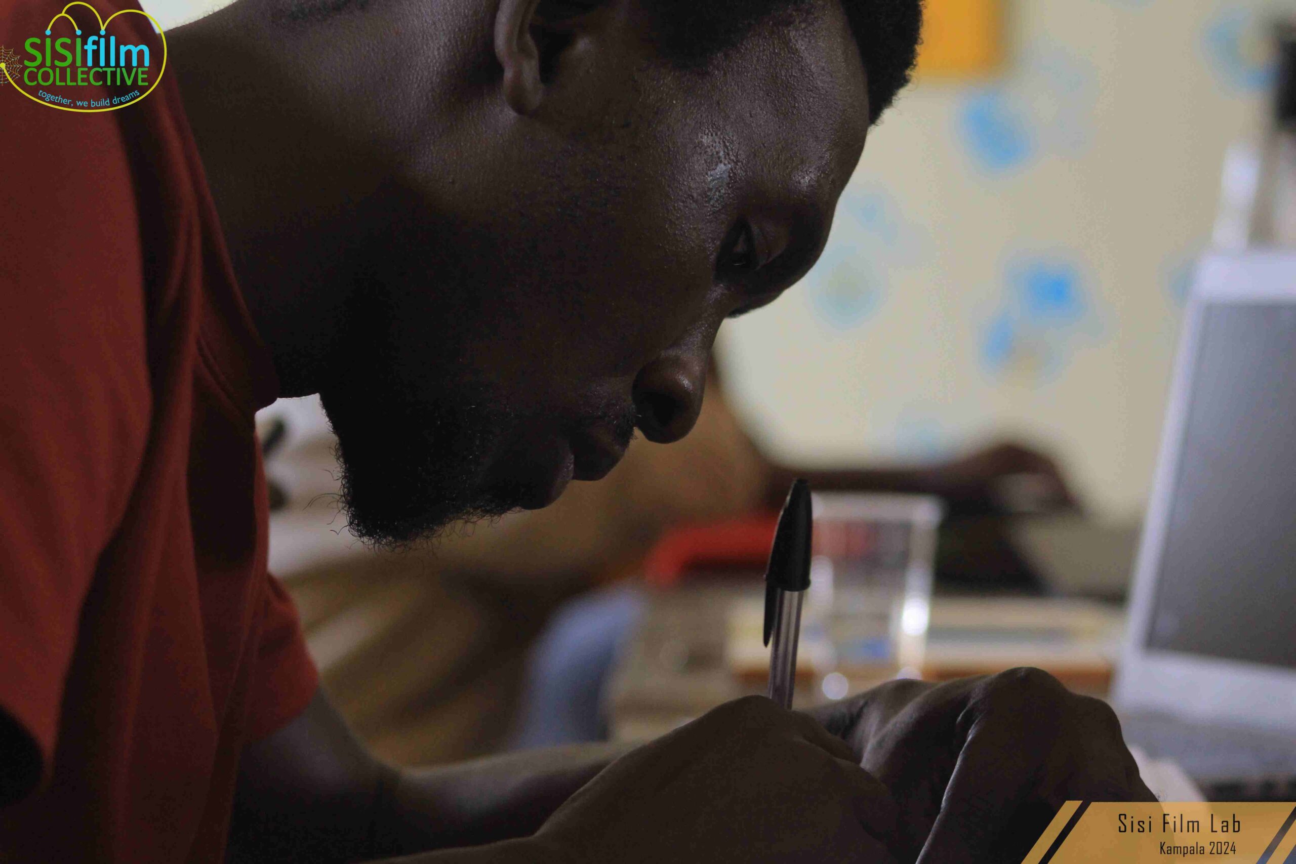 One of the Sisi film lab students attending a script writing class with enthusiasm and focus.