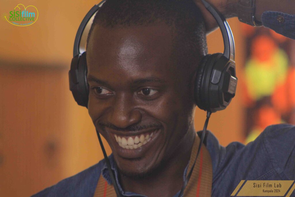 Victor smiling while enjoying sound recording during the sound class.