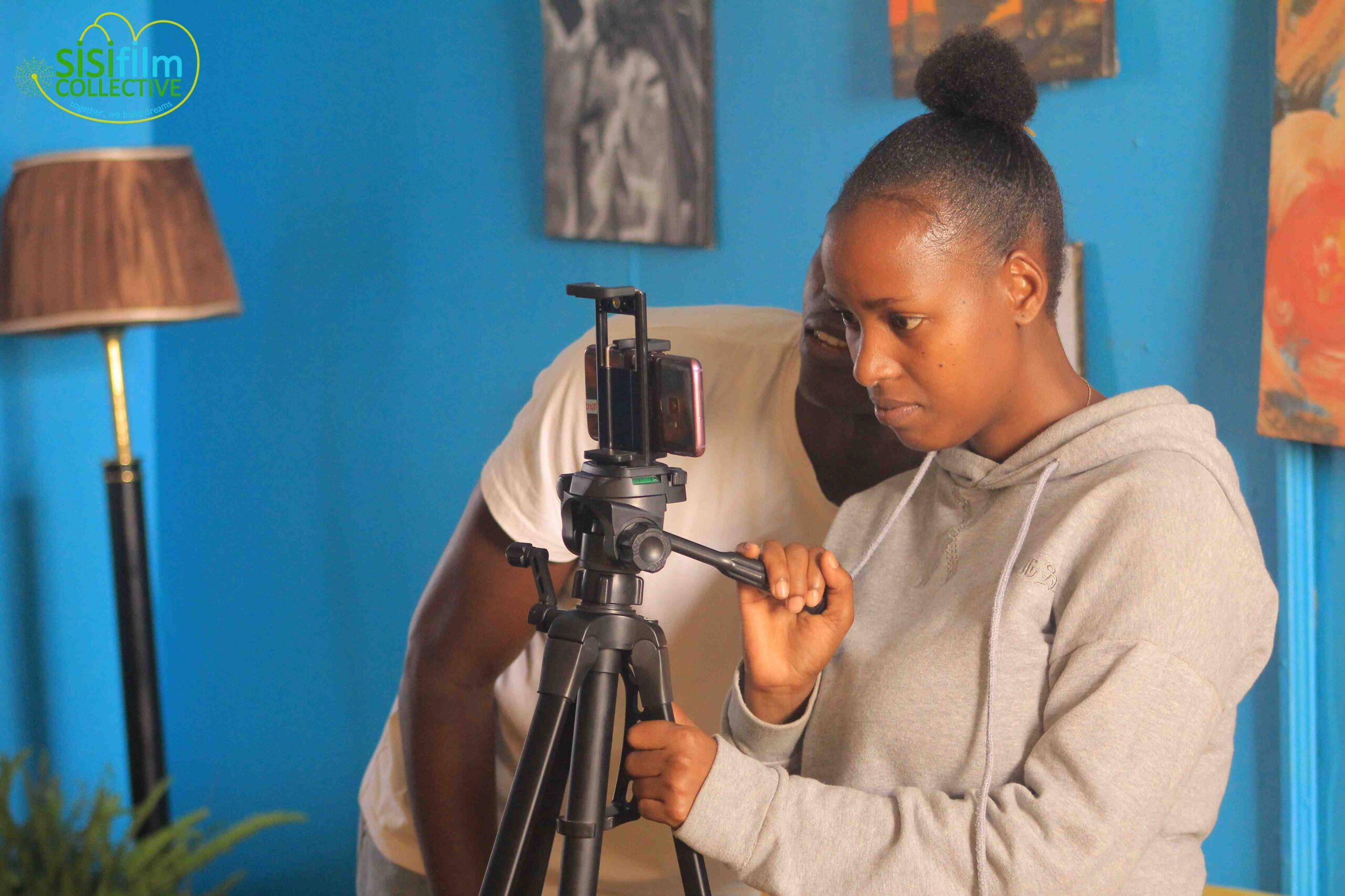 Patricia and smoke using a phone to shoot during the student's short film exercises.