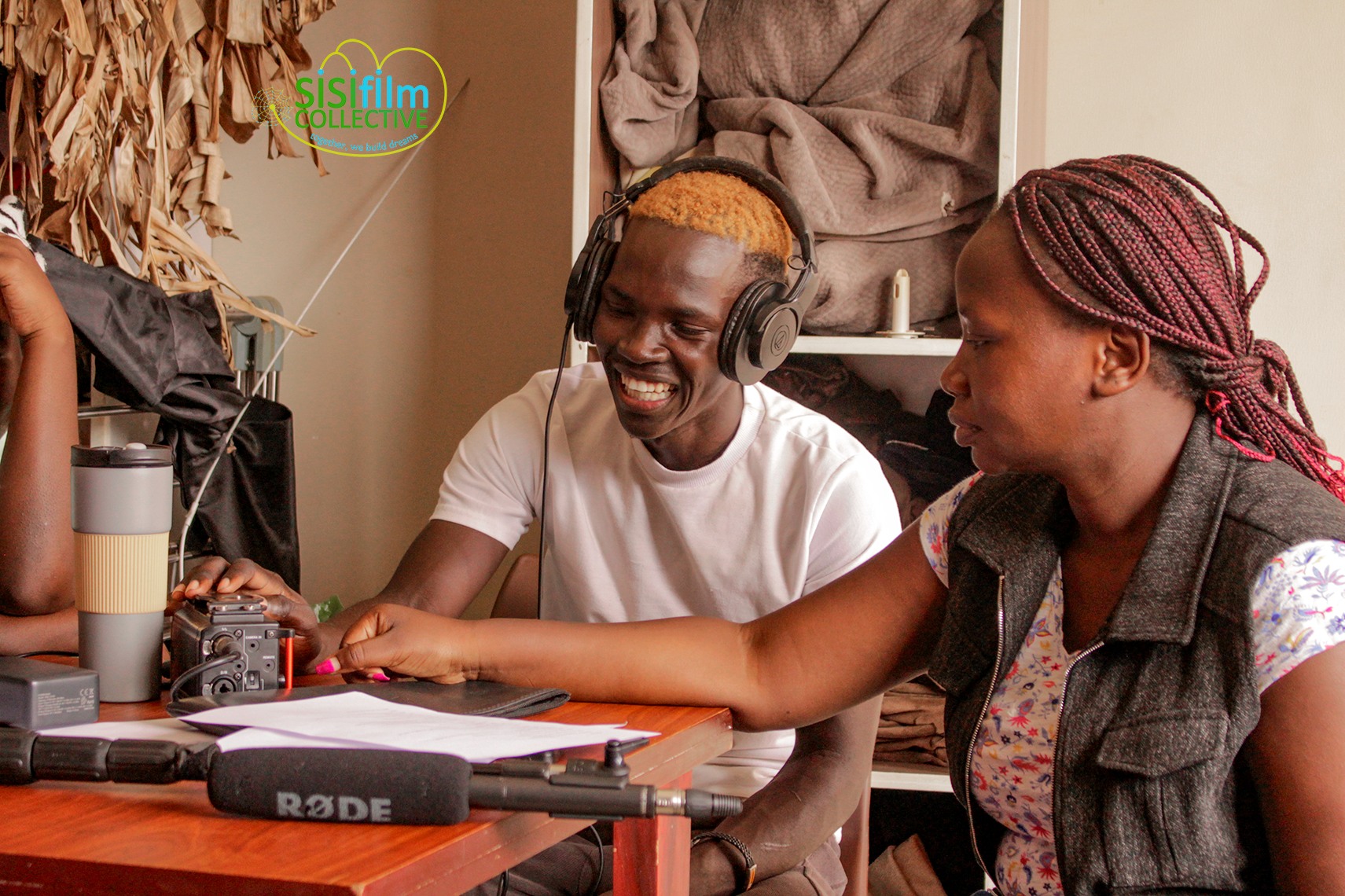 Participants practice recording and listening to audio during their sound recording session.